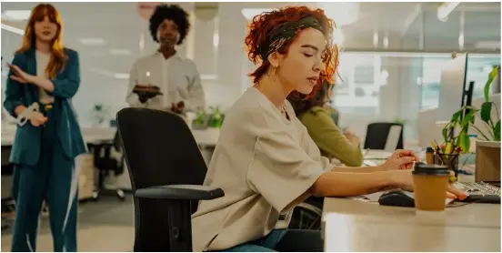 Lady at desk with coffee Lady at desk with coffee