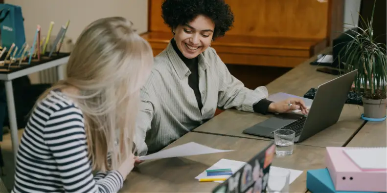 People working over desk