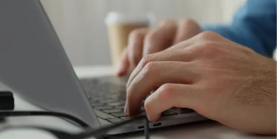 Hands on laptop typing