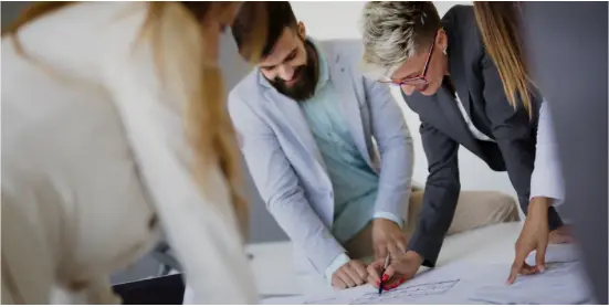 People working over a table