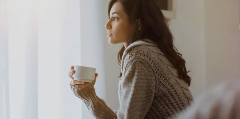 Lady drinking a coffee