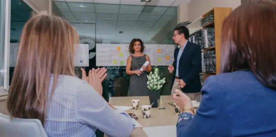 Individuals greeting each other in office