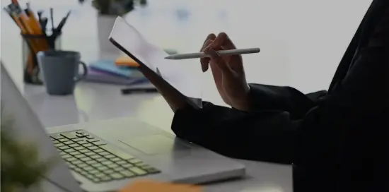 Working on a document by laptop Working on a document by laptop